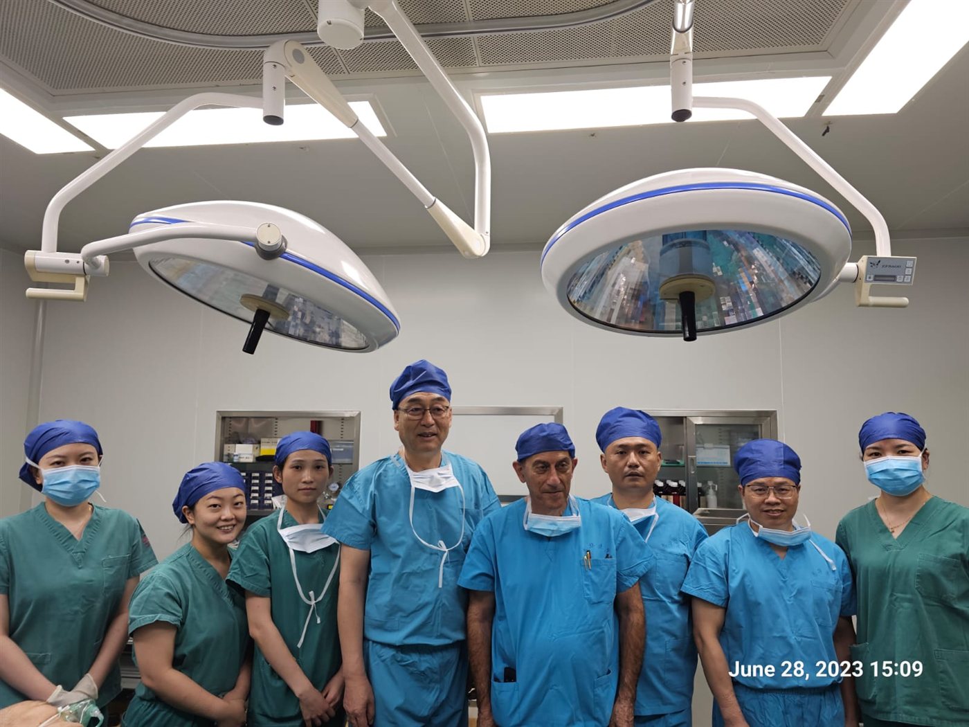Dr. Topaz with a surgical team in an operating room in China
