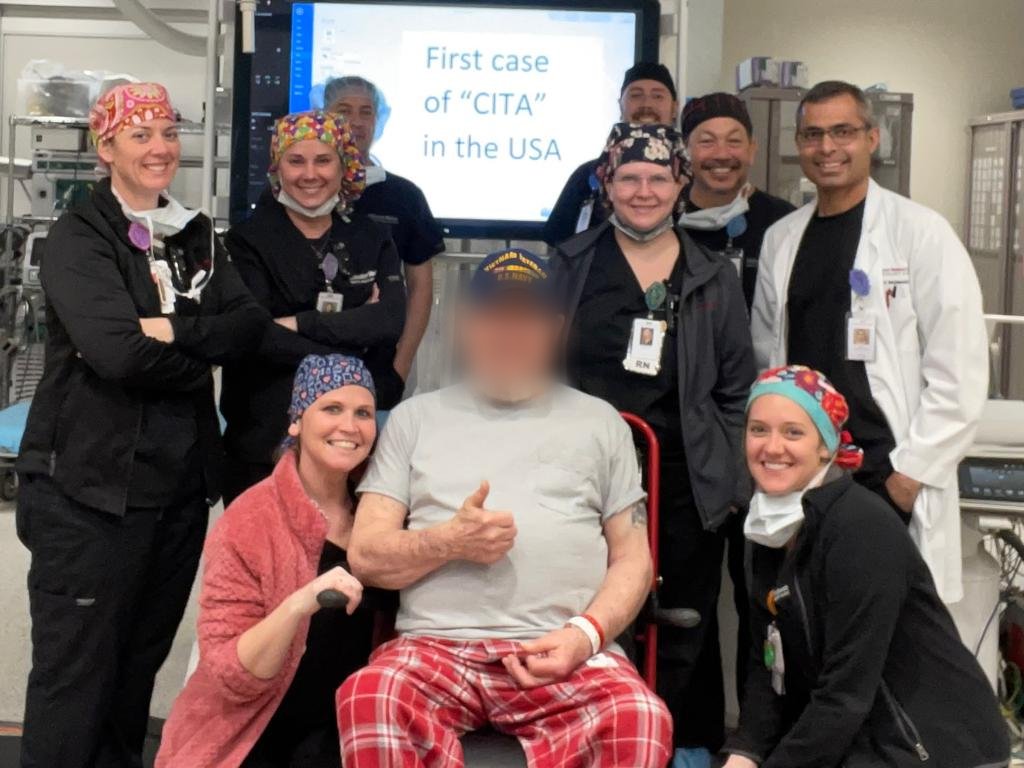 An American surgical team celebrating the first case of the CITA method in the USA with the recovering patient